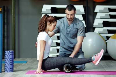 woman doing exercise with therapist